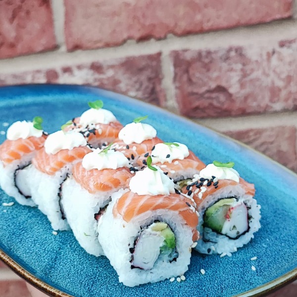 Salmon California roll with salmon, crabstick, and cream cheese.