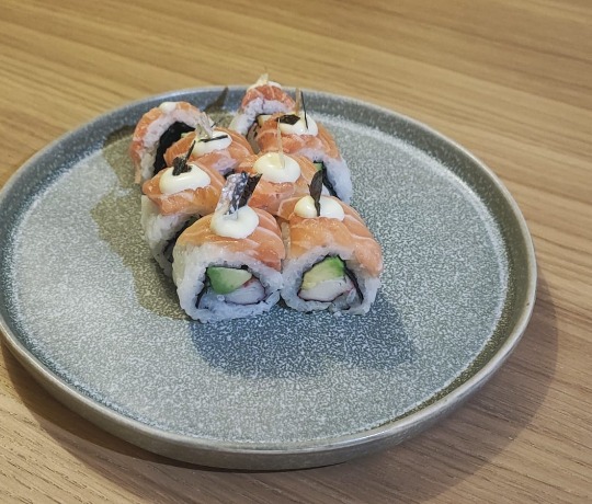 The Salmon Skin Roll, a weekly premium offering with salmon, crispy salmon skin, and mayo.