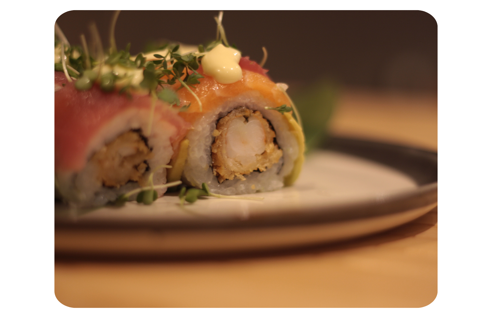 A Rainbow Roll with prawn, salmon, tuna, and avocado.