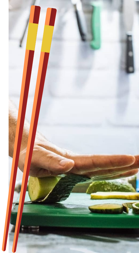 Our chef carefully crafting and rolling cucumber while slicing.